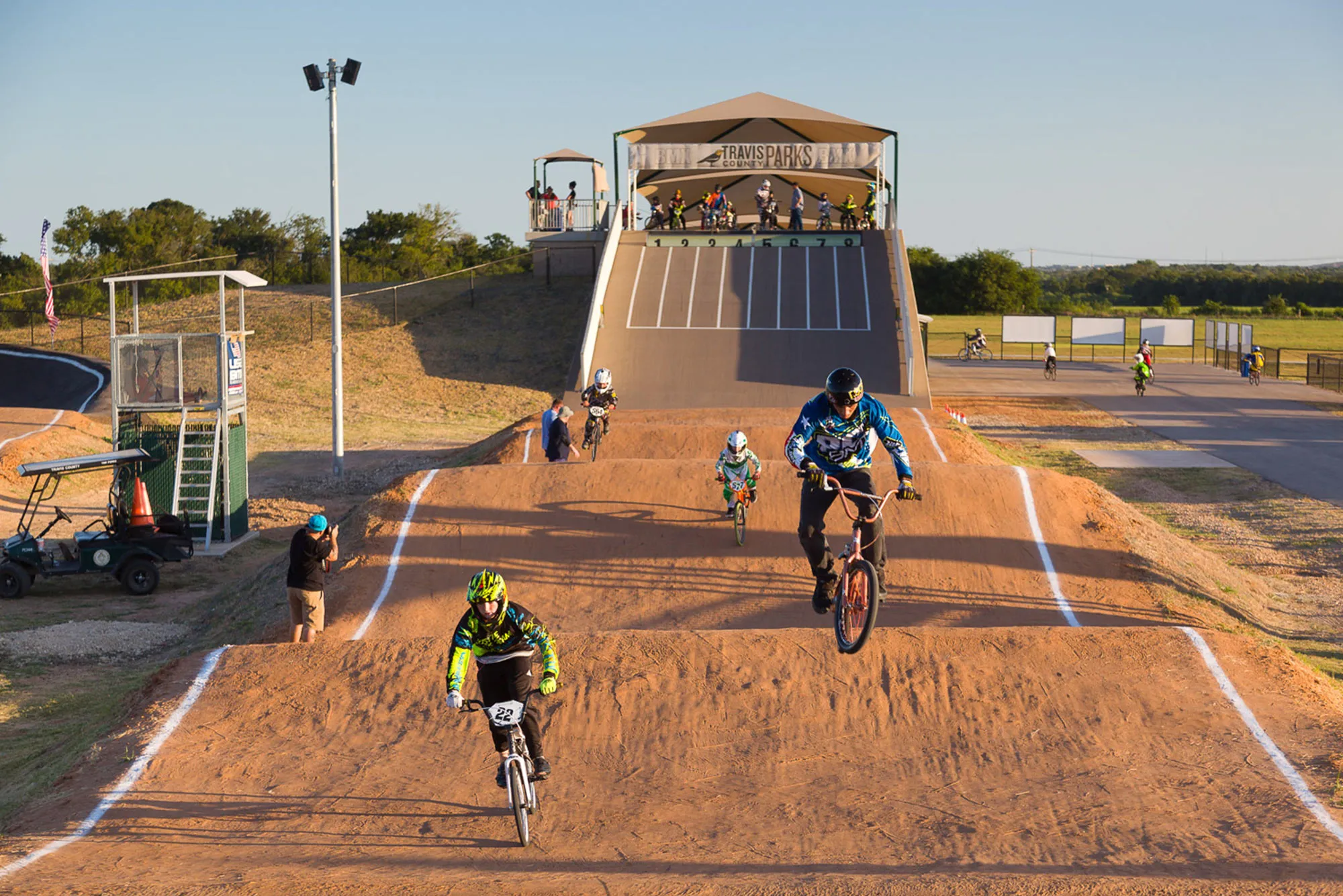 BMX riders racing at Travis County Park in Pflugerville.